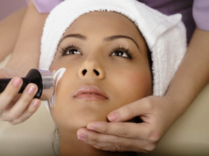 Woman having microdermabrasion